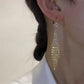 Boucles d'oreilles avec pattes en zircon