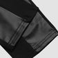 PANTALON EN SIMILI-CUIR AVEC BORDURE ET FERMETURE ÉCLAIR CONTRASTANTES